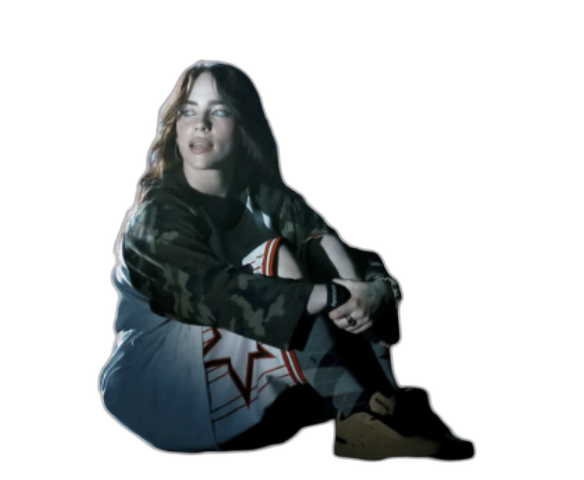 Musician seated in camo hoodie and baggy jeans